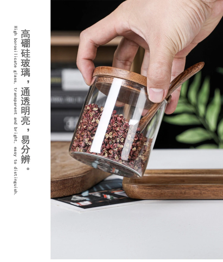 Glass seasoning jar with wooden lid and spoon